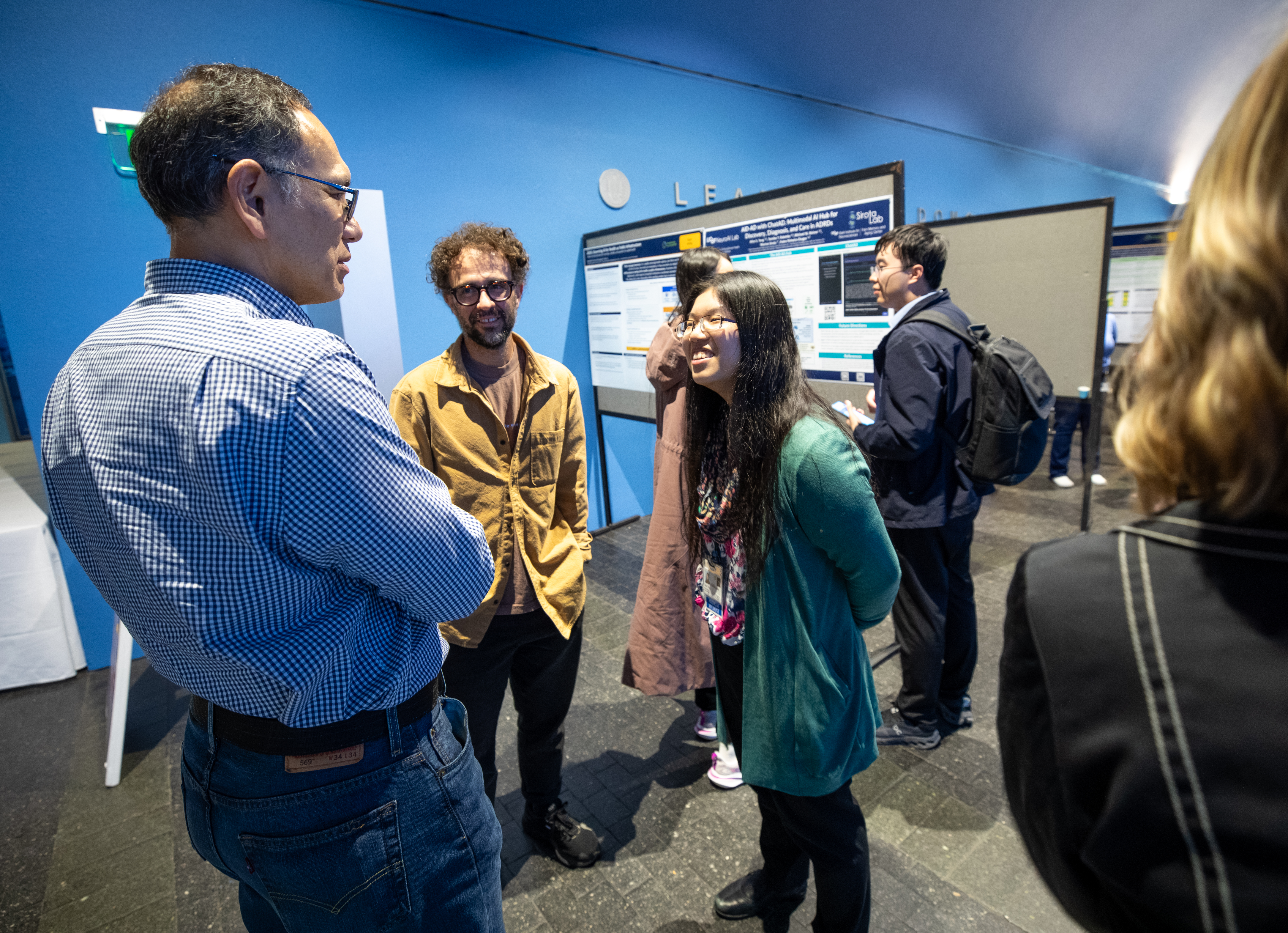 UCSF faculty, staff and trainees reviewing posters